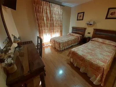 Cama o camas de una habitación en Hotel El Pentágono