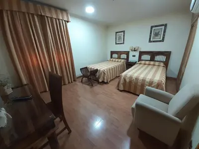 Cama o camas de una habitación en Hotel El Pentágono