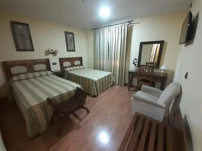 Cama o camas de una habitación en Hotel El Pentágono