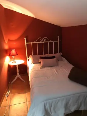 Cama o camas de una habitación en Hostal La Caballeriza