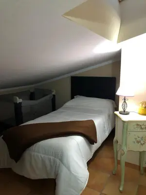 Cama o camas de una habitación en Hostal La Caballeriza