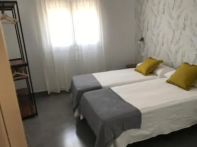 Cama o camas de una habitación en Apartamentos Ad Theatrum