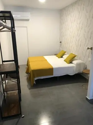 Cama o camas de una habitación en Apartamentos Ad Theatrum