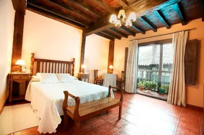 Cama o camas de una habitación en CASA RURAL LOS PORTALES Valle del Jerte