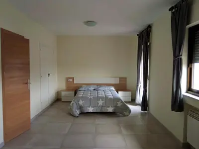 Cama o camas de una habitación en La Villa Hostal