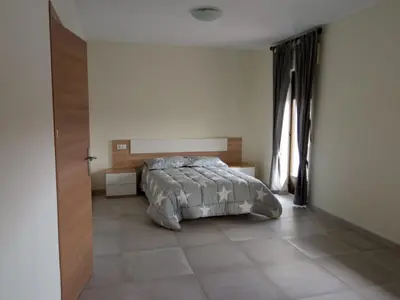 Cama o camas de una habitación en La Villa Hostal