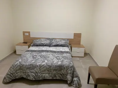 Cama o camas de una habitación en La Villa Hostal