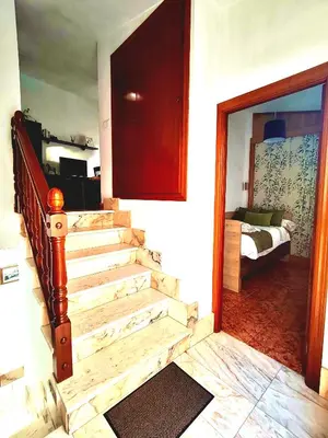 Cama o camas de una habitación en La casa de Tentenecio