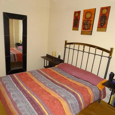 Cama o camas de una habitación en INTRAMUROS alojamiento dentro de la muralla