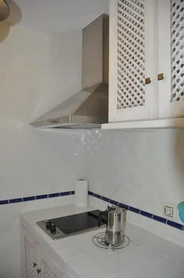 Una cocina o zona de cocina en Apartamentos Boutique Doña Maria La Brava