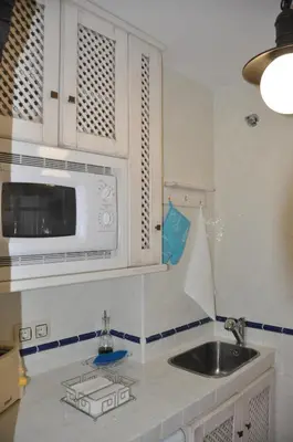 Una cocina o zona de cocina en Apartamentos Boutique Doña Maria La Brava