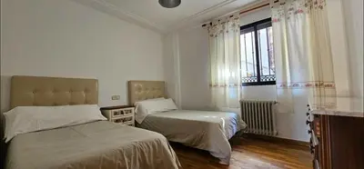 Cama o camas de una habitación en Apartamentos GARDEN
