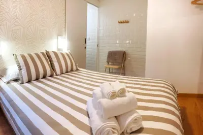 Cama o camas de una habitación en El Escondite de la Muralla