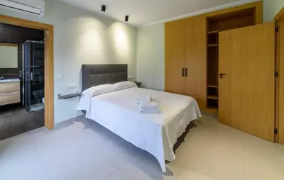 Cama o camas de una habitación en Apartamentos Rurales La Gloria de Yuste