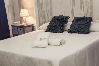 Cama o camas de una habitación en Destino Deluxe Plaza de la Audiencia