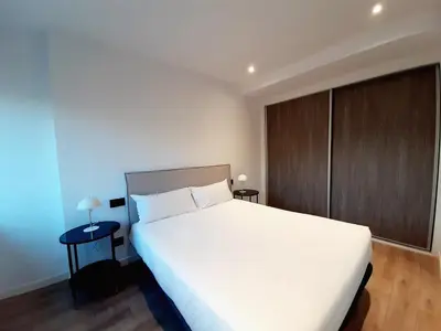Cama o camas de una habitación en Apartamentos Celestina by gaiarooms