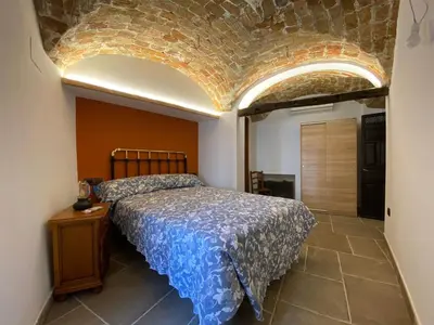 Cama o camas de una habitación en La Casa de Abajo