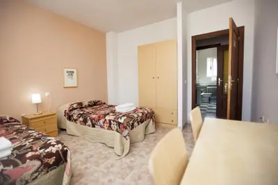 Cama o camas de una habitación en Apartamento Turístico La Ribera del Marco