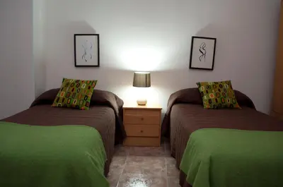 Cama o camas de una habitación en Apartamento Turístico La Ribera del Marco