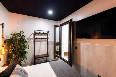 Cama o camas de una habitación en Apartamentos turísticos MAJMA