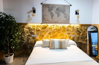 Cama o camas de una habitación en Apartamentos turísticos MAJMA