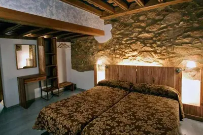 Cama o camas de una habitación en EL Molino de Tormellas exclusivo alojamiento rural