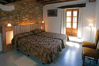 Cama o camas de una habitación en EL Molino de Tormellas exclusivo alojamiento rural