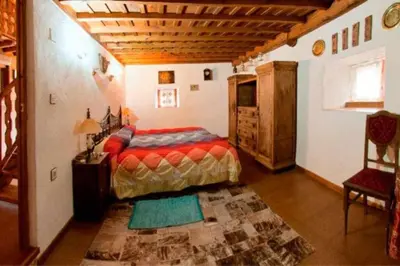 Cama o camas de una habitación en Casa Tía Modesta es una cálida y acogedora casa rural.