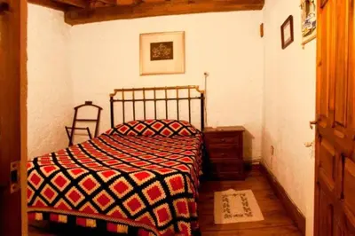 Cama o camas de una habitación en Casa Tía Modesta es una cálida y acogedora casa rural.