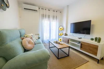 Una televisión o centro de entretenimiento en Apartamento Boutique Plasencia Centro
