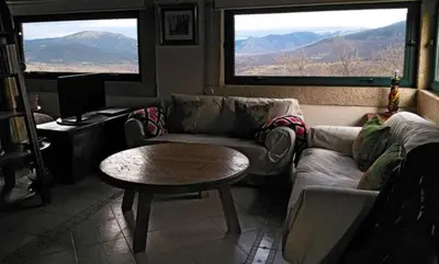 Zona de estar de Apartamento Rural El Herrero, vistas espectaculares a Gredos