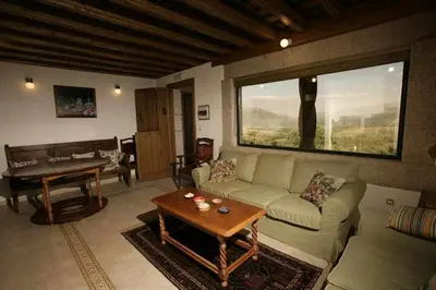 Zona de estar de Apartamento Rural El Labrador es un cómodo y acogedor apartamento.
