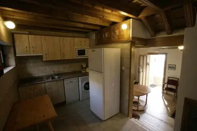 Una cocina o zona de cocina en Apartamento Rural El Labrador es un cómodo y acogedor apartamento.