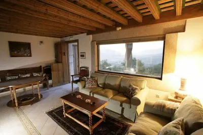 Zona de estar de Apartamento Rural El Labrador es un cómodo y acogedor apartamento.