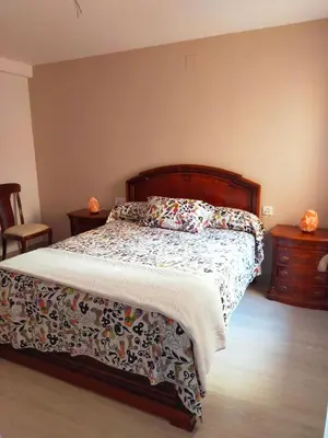 Cama o camas de una habitación en El balcón de Alba