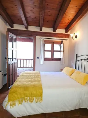 Cama o camas de una habitación en Casa Rural El Campanario
