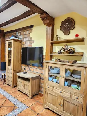 Una televisión o centro de entretenimiento en Casa Rural El Campanario