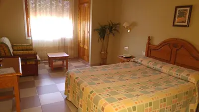 Cama o camas de una habitación en LAS GLORIAS