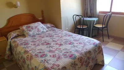 Cama o camas de una habitación en LAS GLORIAS
