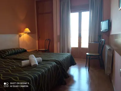 Cama o camas de una habitación en LAS GLORIAS