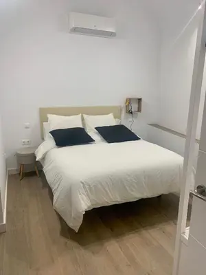Cama o camas de una habitación en PUERTA DE CACERES Apartamento 2