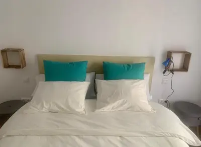 Cama o camas de una habitación en PUERTA DE CACERES Apartamento 4