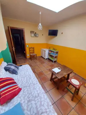 Una televisión o centro de entretenimiento en Casa Rural El Callejo