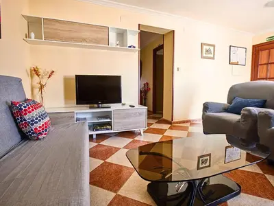 Una televisión o centro de entretenimiento en Apartamento Los Mayorales