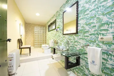 Un baño de Apartamentos El Capricho