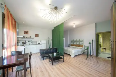 Cama o camas de una habitación en Apartamentos El Capricho