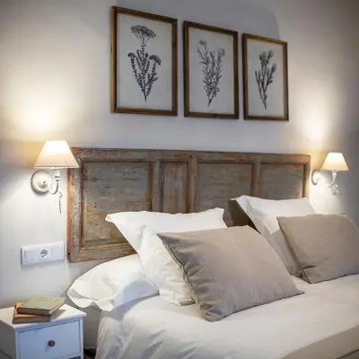 Cama o camas de una habitación en Apartamentos Petronila 1881