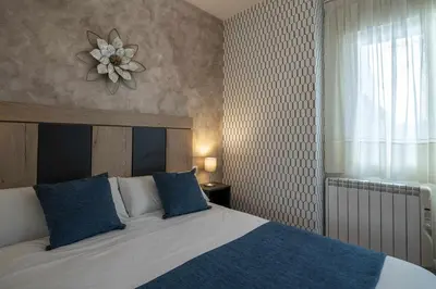 Cama o camas de una habitación en Casa Rural La Posada del 42