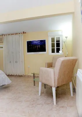 Una televisión o centro de entretenimiento en Apartamento La Relojera 1