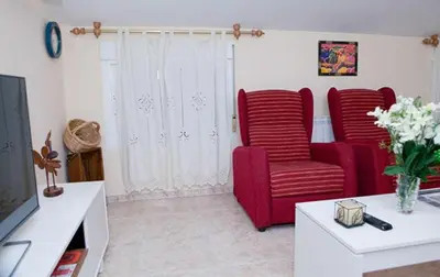 Una televisión o centro de entretenimiento en Apartamento La Relojera 1